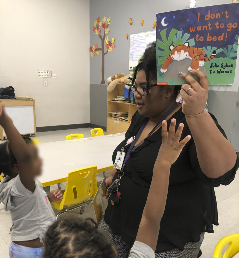 Staff volunteers at child care center