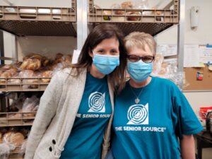 staff volunteers at food bank